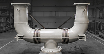 U-shaped pipe assembly for vaccum incorporating pipe bellows