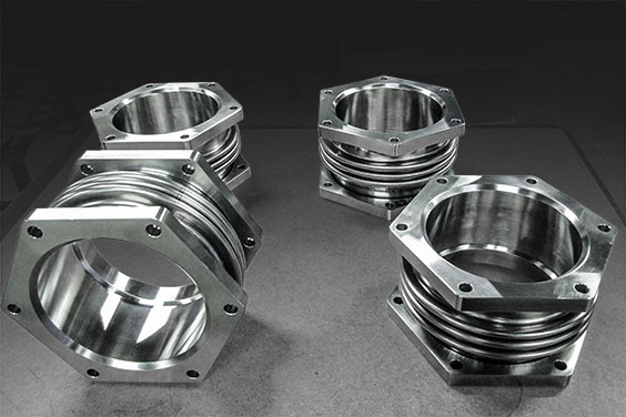 Exhaust bellows with polygonal flanges